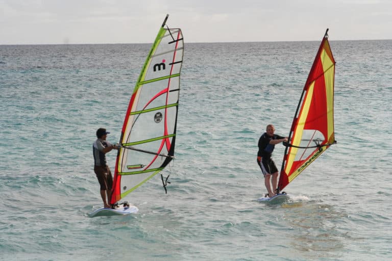 Two People Windsurfing